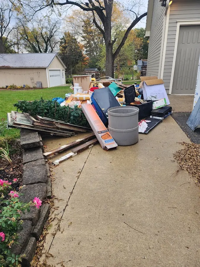 Dumpster being loaded with debris for 3 Yard Dumpster Rental in Farmville